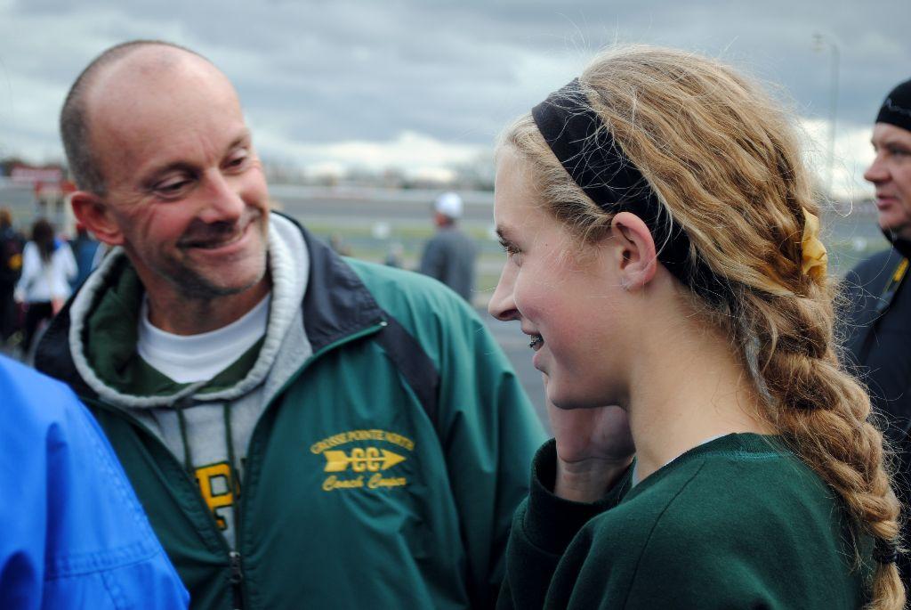 Coach Cooper congratulating Chloe Bigwood after her run.
