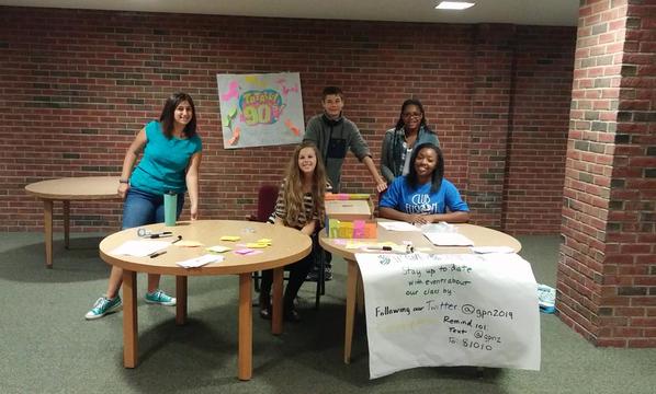 Freshmen work a table at orientation. Photo provided by Liz Michaels.