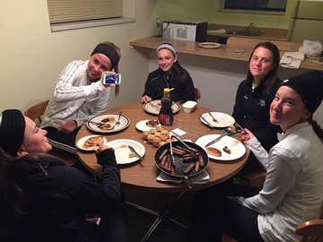 The girls varsity golf team shares breakfast together during their weekend at states.