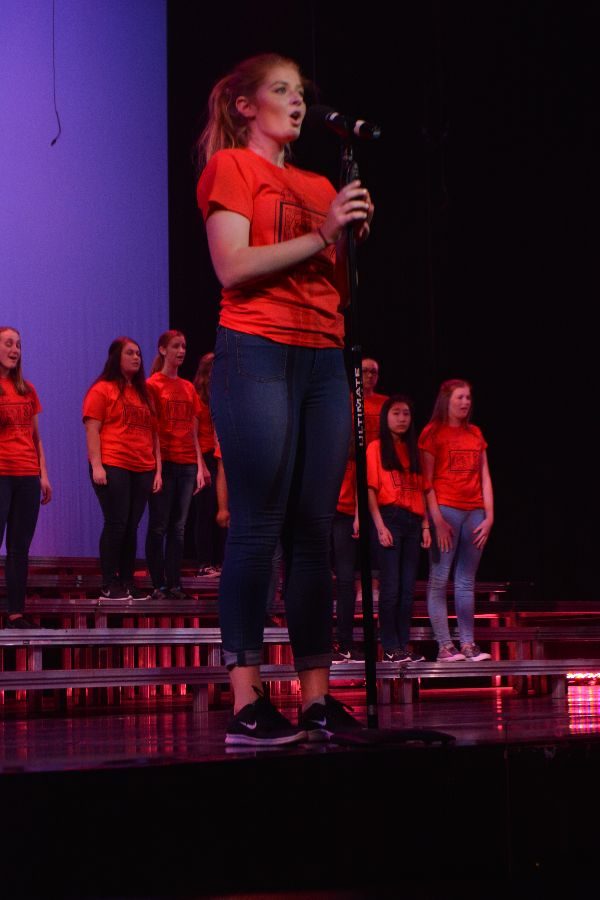 Freshman Noelle Conrad serenades the audience during Treble choirs performance of All Good Gifts.