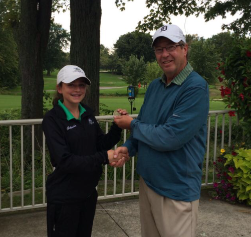 Girls golf coach Pete Kingsley (right) with sophomore Megan Gallagher (left) after a match.