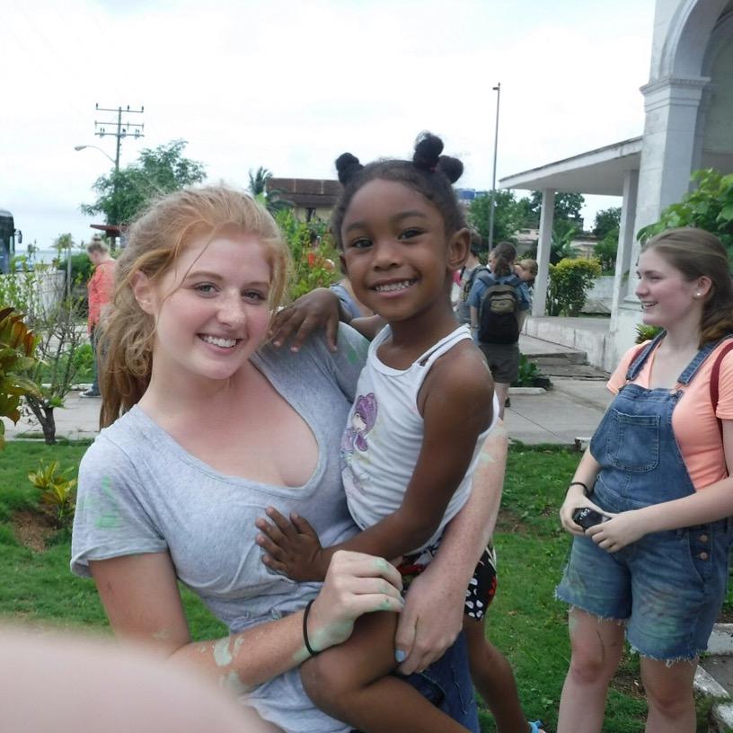 Sophomore+Noelle+Conrad+volunteers+at+a+Cuban+orphanage+while+on+the+mission+trip.