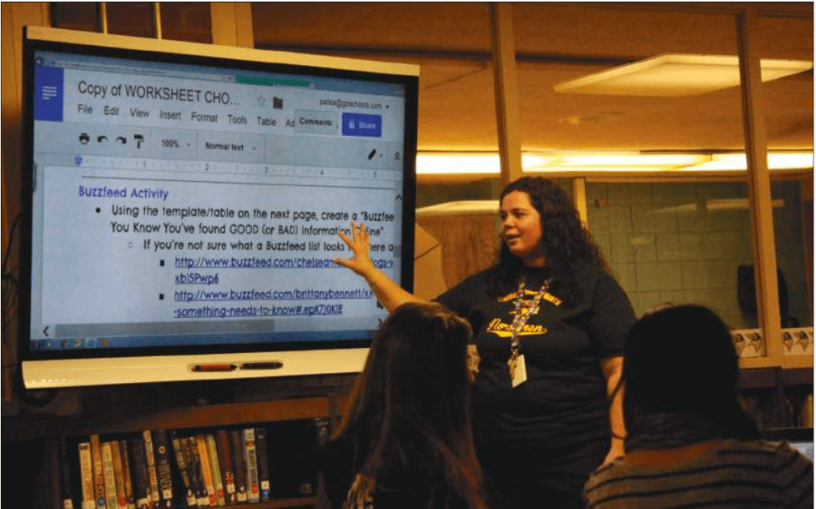 Library media specialist Amanda Pata presents to freshmen in the library. The library has not had any major renovations since the school was originally built.