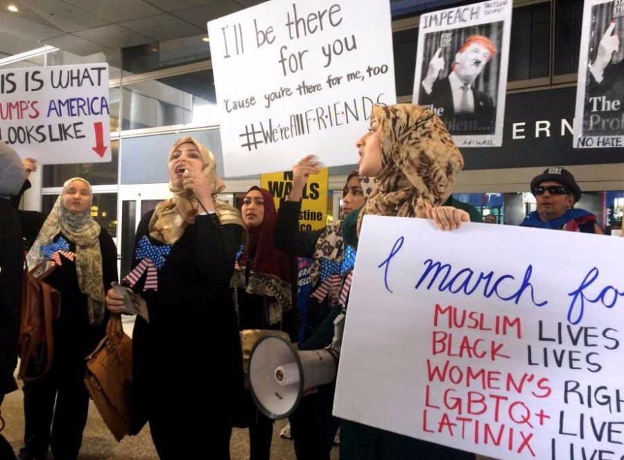 Protesters against Trumps travel ban stood up together in different places, especially airports.
