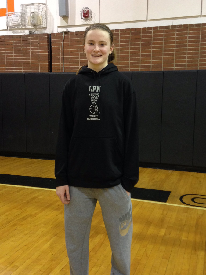 Sophomore Julia Ayrault smiles after the game where she broke the record for most points scored in an individual game.