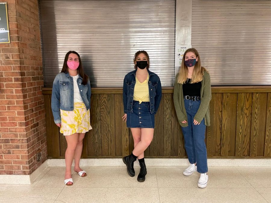 Senior Emily McCloskey, sophomore Isabella Yoakam and senior Eliza Ellery don different denim clothes to participate in Denim Day. Ellery said that the purpose of wearing denim was to spread awareness of important issues in the community. The purpose of denim day was to spread awareness of and take a stand against sexual assault harassment, Ellery said.